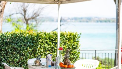 Table outdoor with umbrella and fruits