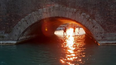 Sunset light reflected under the bridge